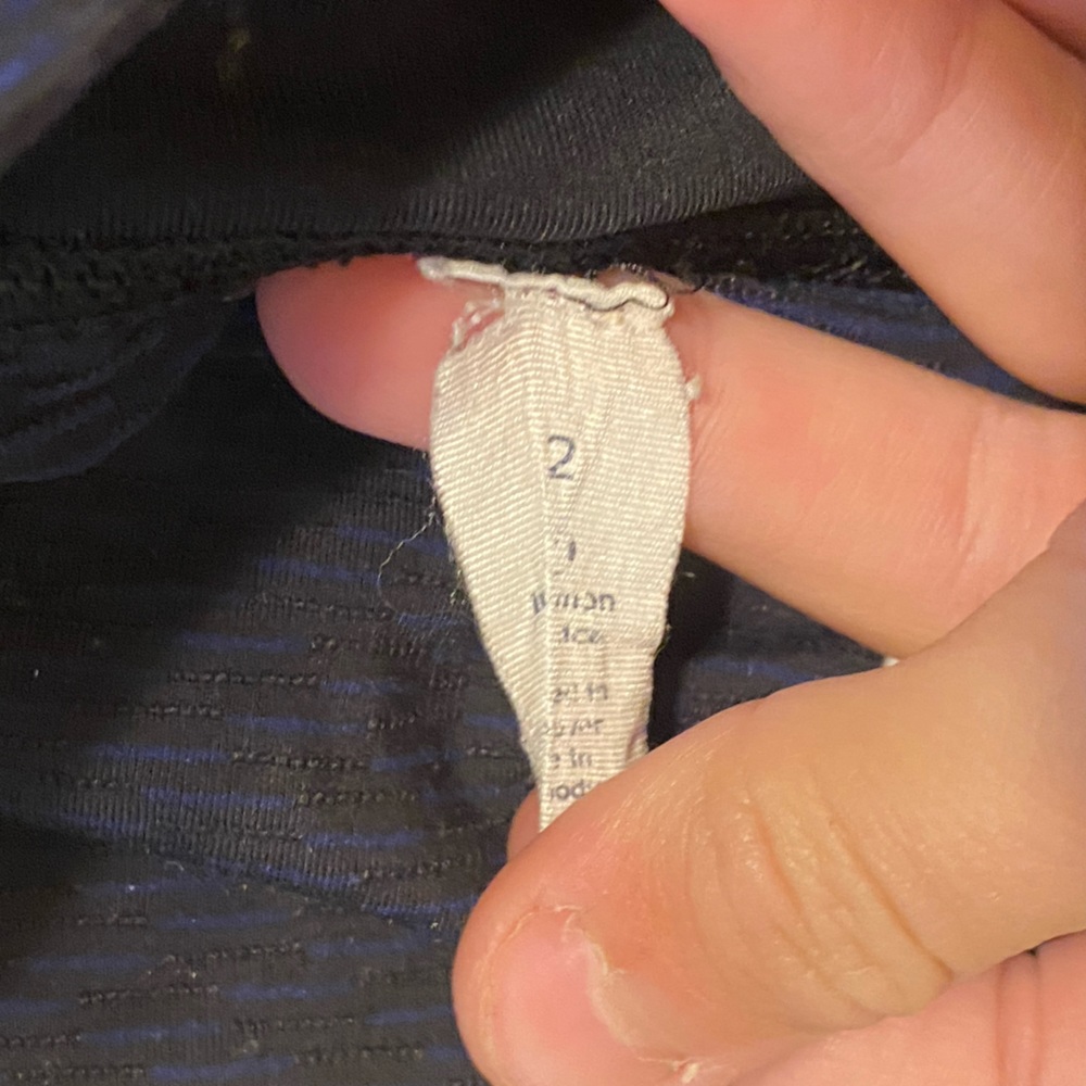 Lululemon size two capri leggings. Navy blue with mesh around bottom. - Picture 2 of 4